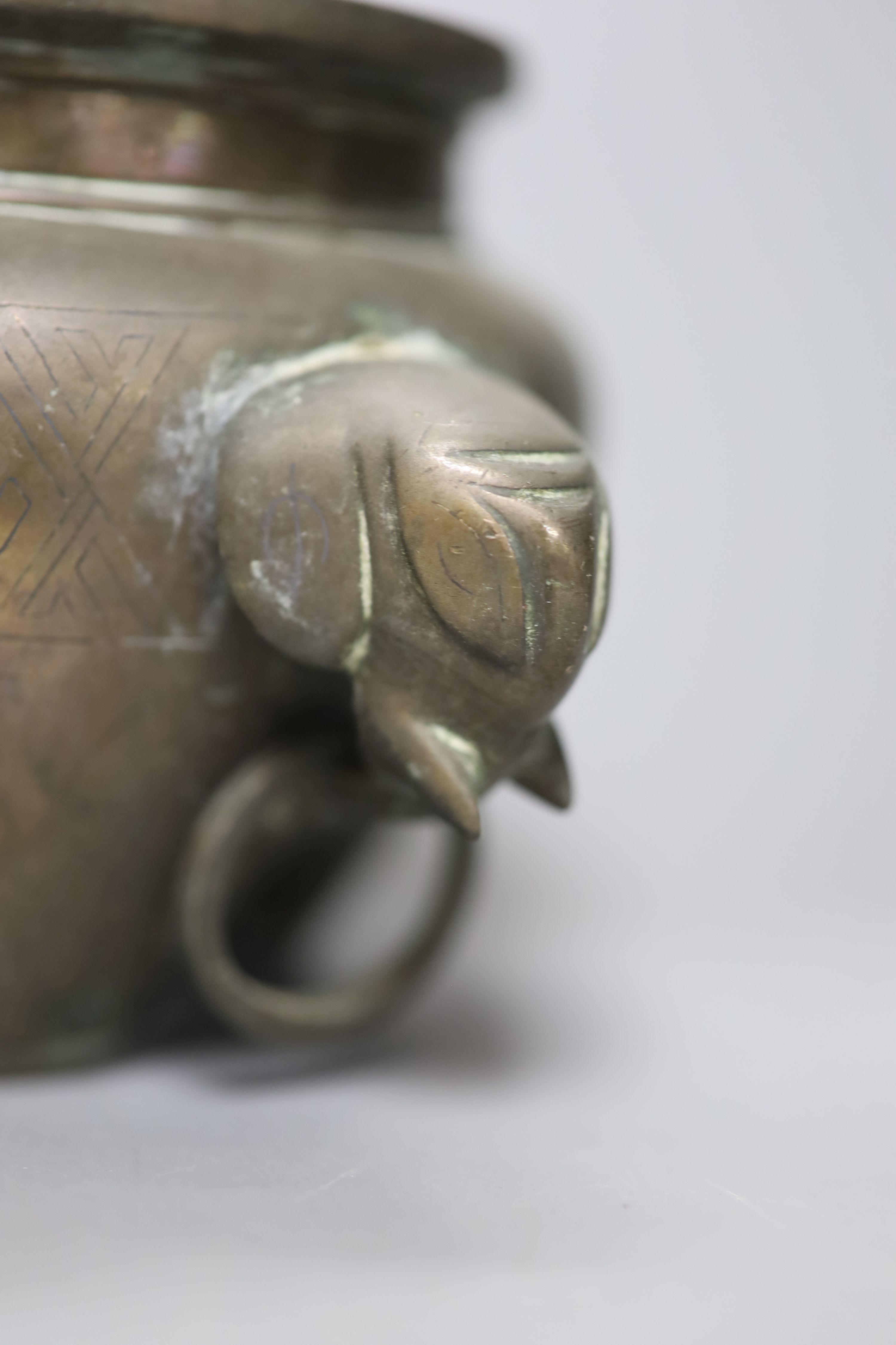 A Chinese bronze and silver inlaid tripod censer, c.1900, a stoneware cover and a crackleglaze inkwell, tallest 10cm